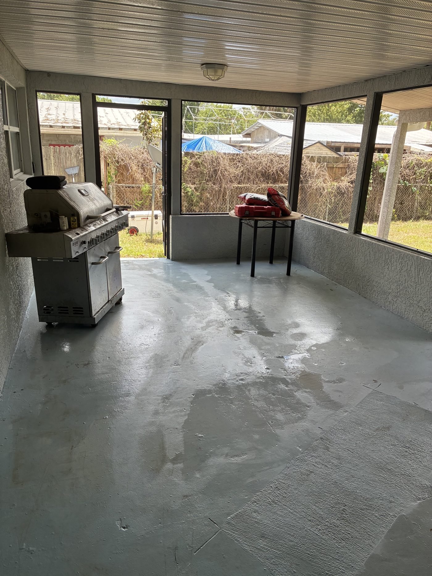 Freshly cleaned screened patio concrete floor