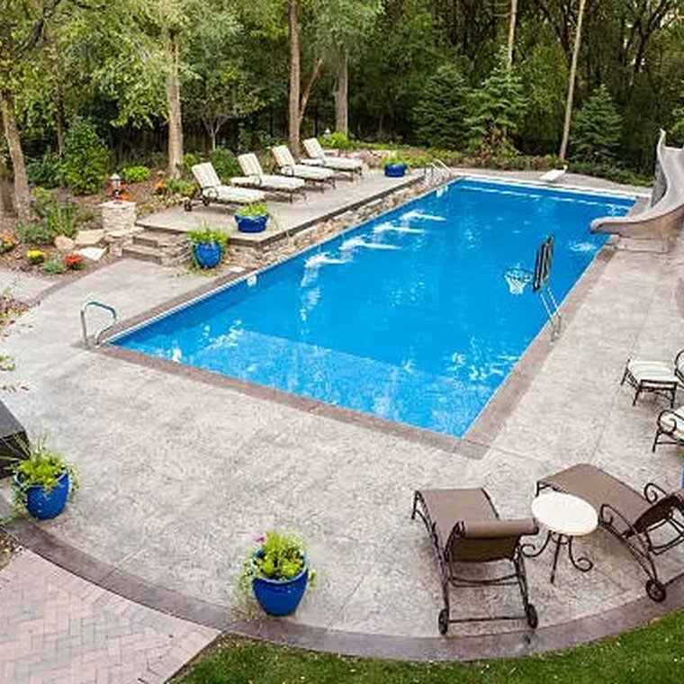 A cleaned pool deck and paver patio