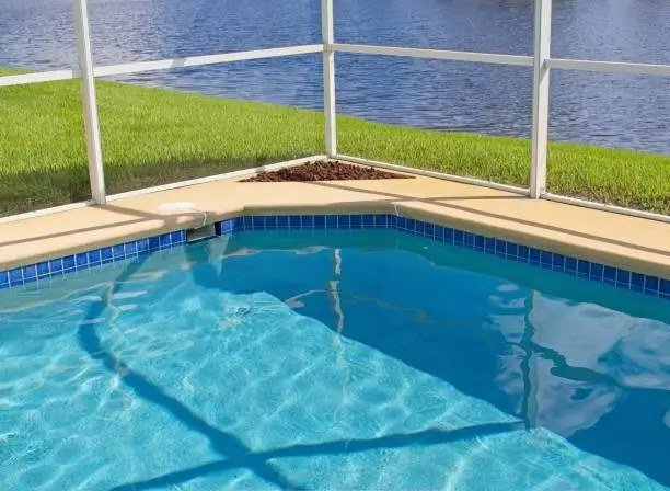 Screen-enclosed pool and deck in Volusia County