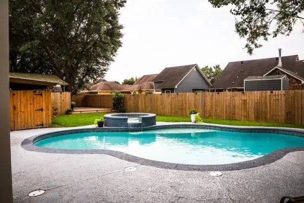 Backyard pool with a freshly cleaned deck