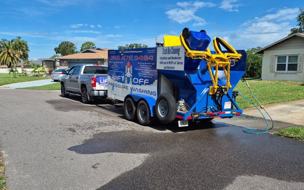 The Lift Off trash bin cleaning rig on a driveway in Volusia County